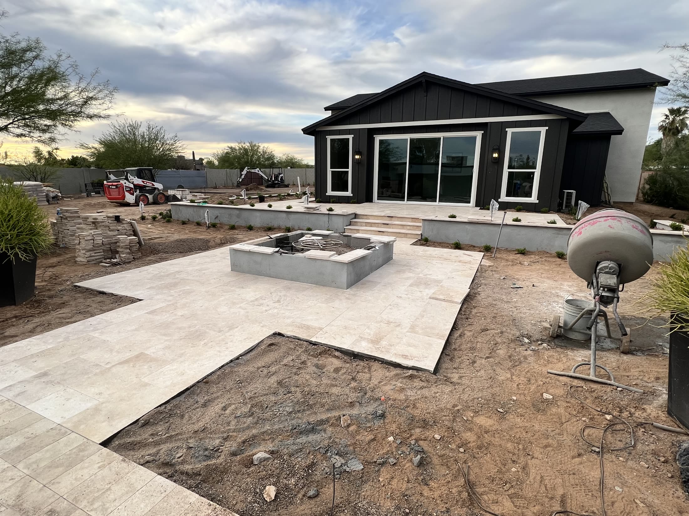 Luxury Arizona backyard patio with pool at dusk, custom built by Tanden Homes